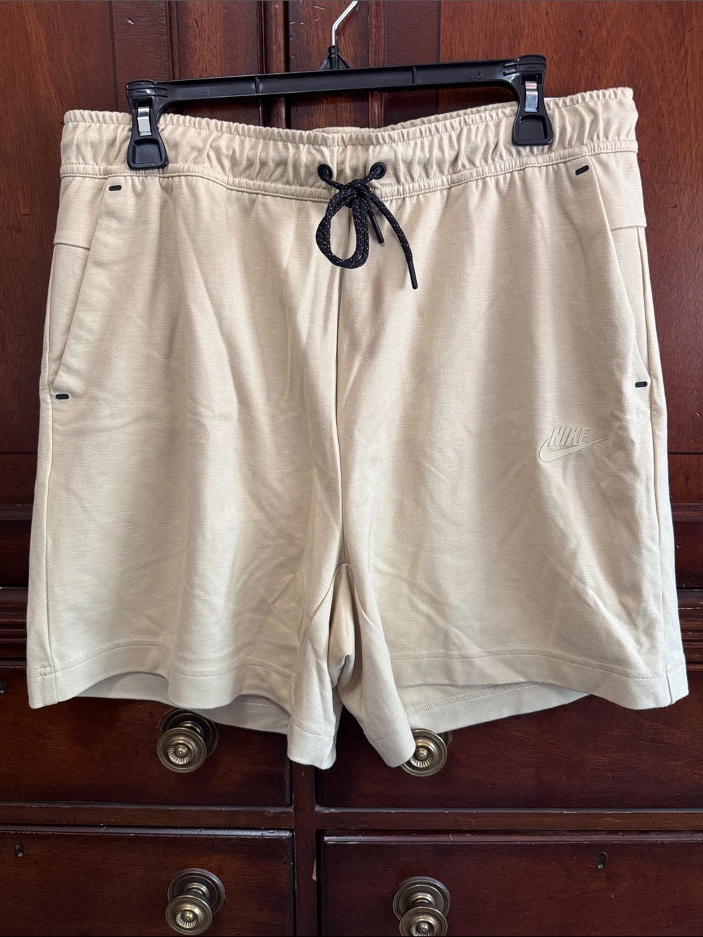 Nike Men's Large Cream Athletic Fleece Shorts with Black accents.